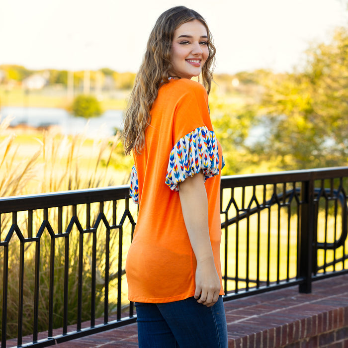 30012 - Orange Top with Geometric Balloon Sleeves