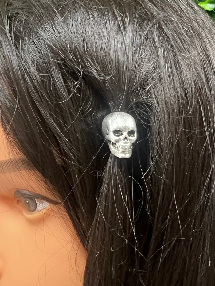 Model wearing Silver Skull Hair Bead at motorcycle rally, silver-overlay braid and loc accessory.