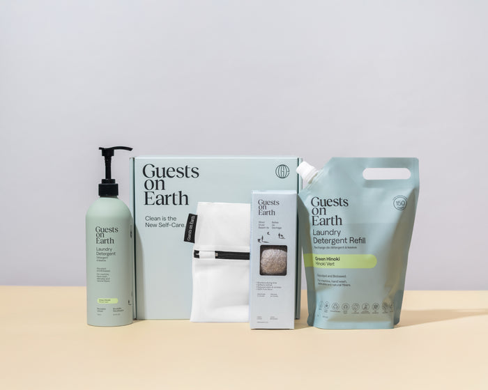 Guests on Earth eco-friendly cleaning products set with laundry detergent, refill pouch, dryer balls and wash bag in gift box
