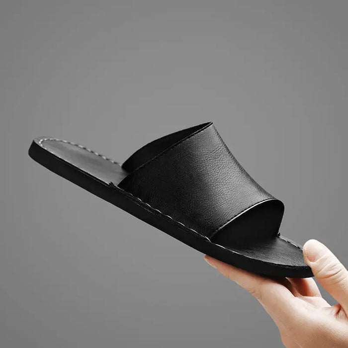 Men's minimalist leather slide sandals with wide straps, designed for comfort and summer wear, from LondonLaneStore.