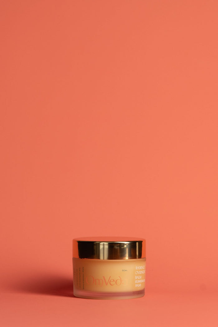 OmVeda Radiance Kumkumadi balm jar with gold lid