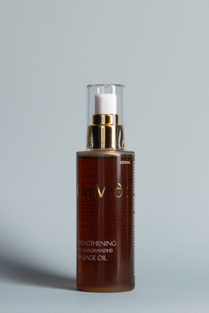 OmVeda strengthening massage oil: amber glass bottle with gold pump, 100ml