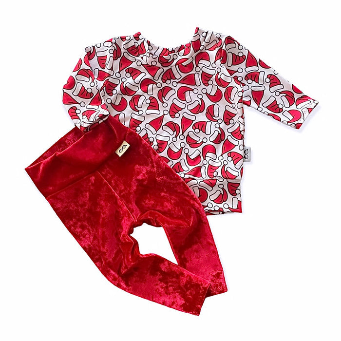 Christmas baby lounge set featuring a Santa Hats print long sleeve shirt and red velvet leggings, perfect for newborns and toddlers during the holiday season.