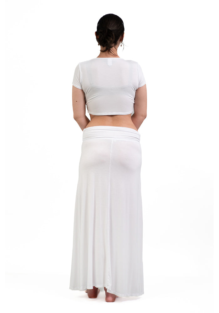 Back view of oman wearing a white rayon/spandex crop-top with short sleeves and front shirring on a white background.