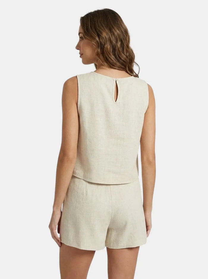 Women's breathable linen summer set with tailored crop top and structured shorts, stylish and comfortable for warm weather.