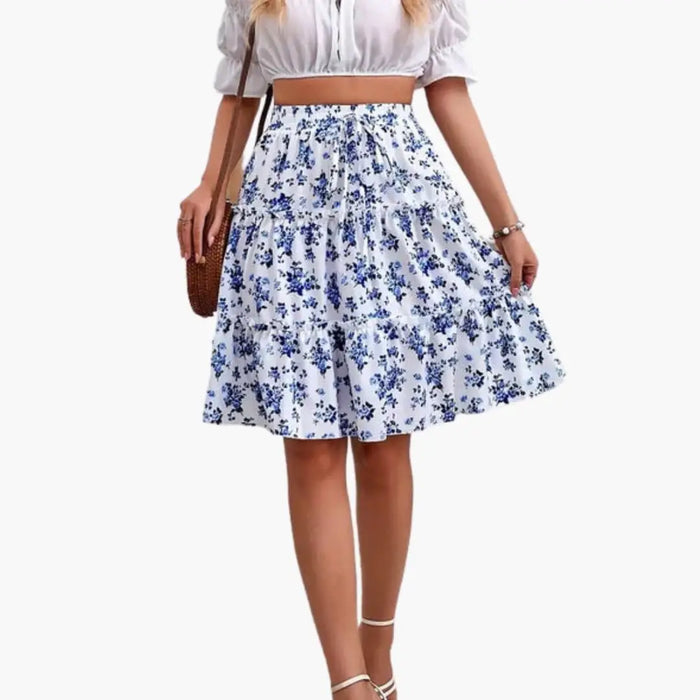Women's floral print midi skirt from LondonLaneStore with a relaxed fit, flared shape, and ruffled hem for summer wear.