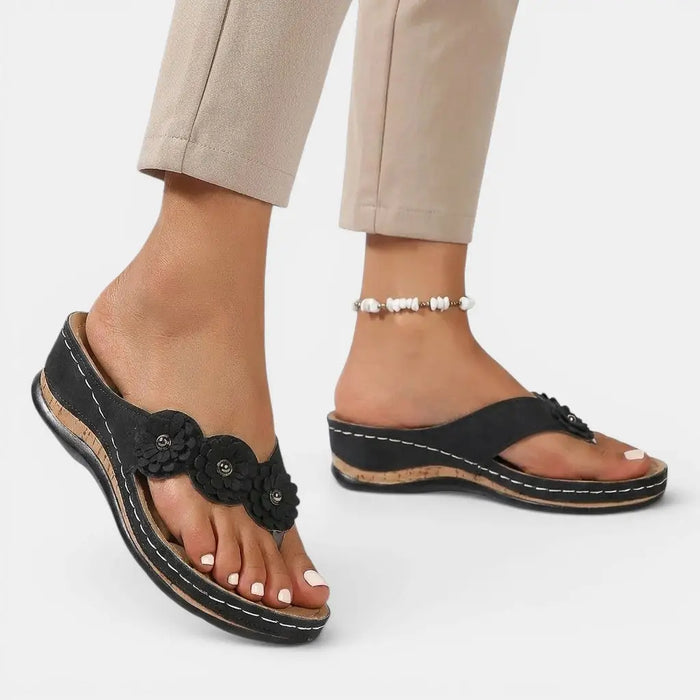 Women's leather slip-on orthopedic sandals with cushioned footbed and elegant design for comfortable everyday wear.