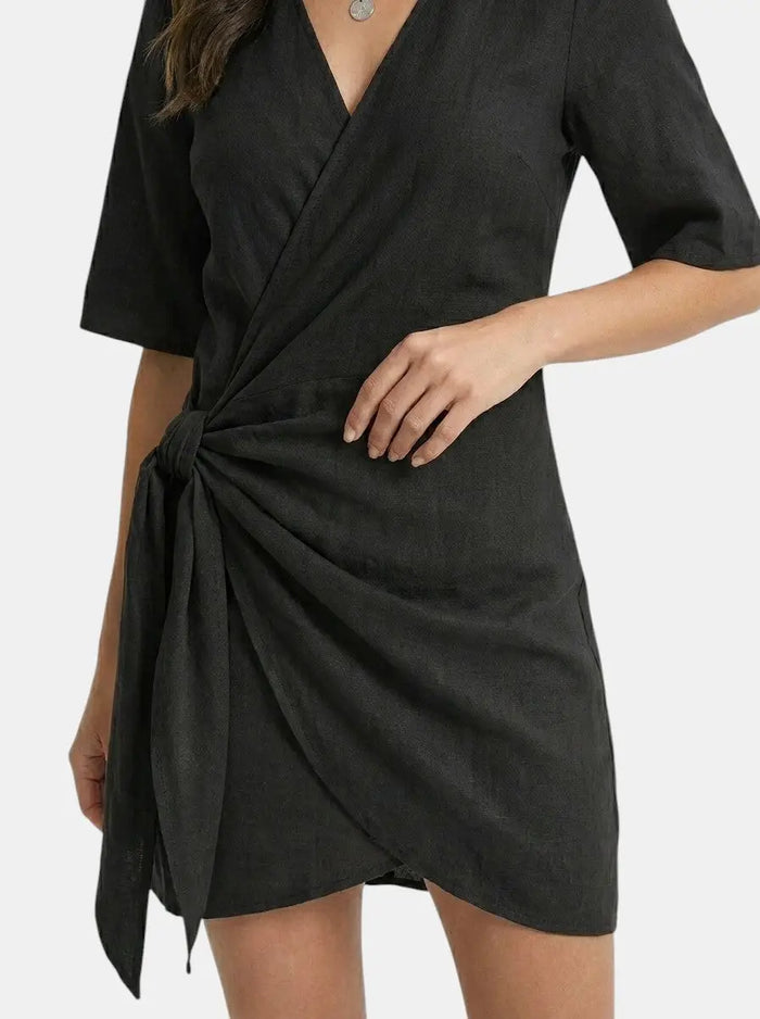 Women’s linen blend wrap mini dress with elegant asymmetrical hem, perfect for summer, from LondonLaneStore.
