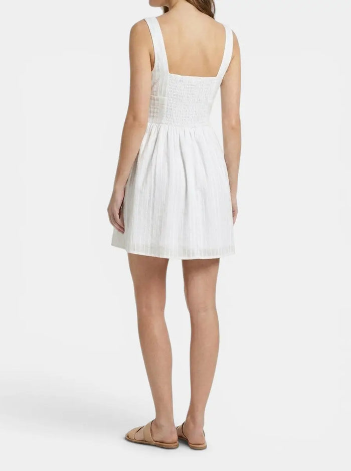 Women's organic cotton white mini summer dress with elegant square neck and ruffle details, perfect for warm weather.