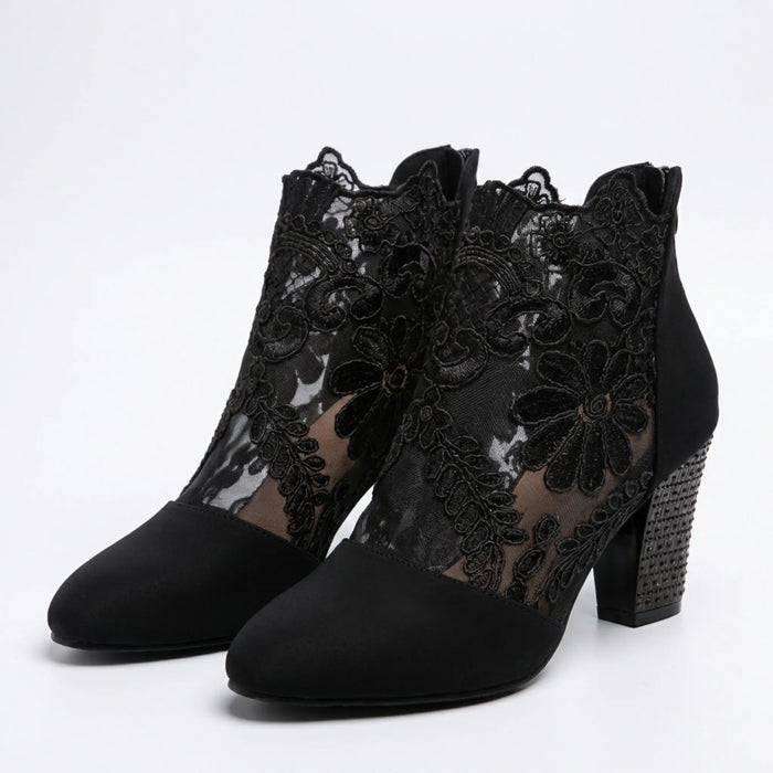 Women's black lace block heel pumps, elegant dress shoes with sheer lace detail and comfortable heel height.