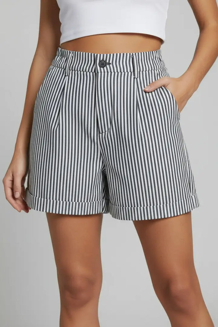 Women's structured high-waist shorts with vertical stripes and tailored design, stylishly displayed in a fashion-focused image.