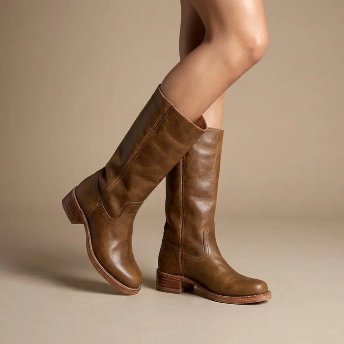 Women's synthetic leather knee-high boots with round toe and stacked heel, featuring a sleek design and comfortable fit.