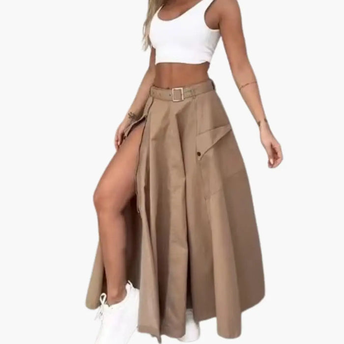 Women's woven maxi skirt with high slit and side pockets, featuring an elegant design in a stylish, flowy fabric.