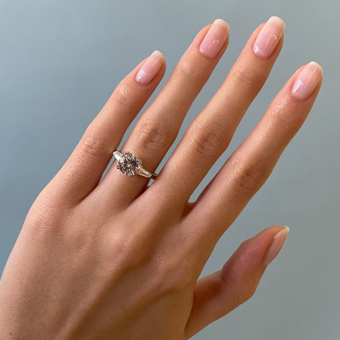 Hand with nails featuring a sheer finish using BEB gel polish, displaying a subtle and polished natural manicure look