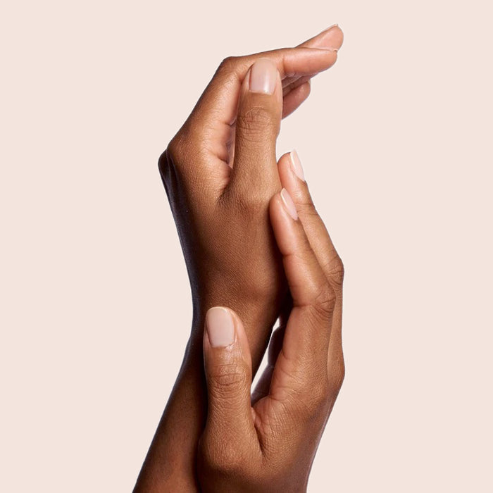 Hands with nails painted in CHM sheer tan for a natural and flattering gel polish manicure look