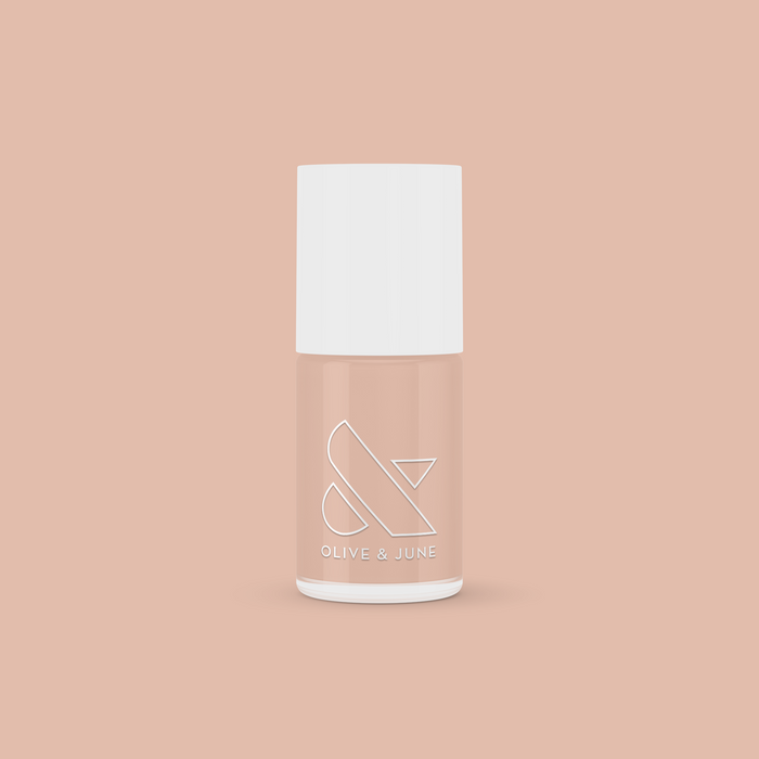 Bottle of CHM gel polish in sheer tan shade by Olive and June for a natural and easy at-home manicure look