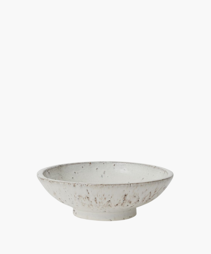 A rustic ceramic bowl with a wide, shallow design, featuring a white glaze speckled with earthy brown tones. The handcrafted look conveys a cozy, artisanal feel. | Wildwood Home Co.