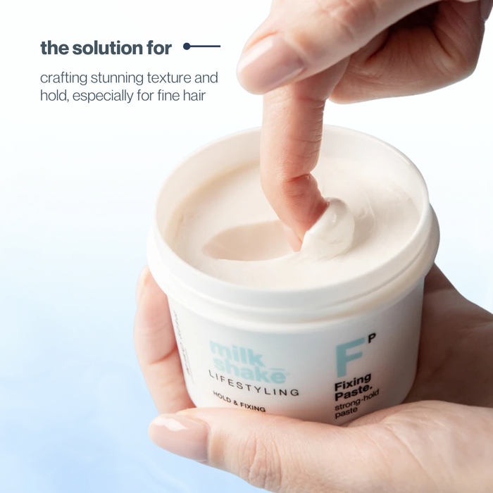 Hand holding a jar of milk_shake  fixing paste with text about hair styling.