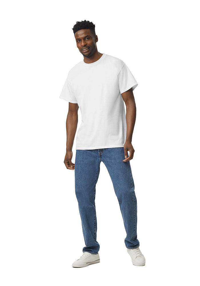 Man wearing a white Gildan 5.3oz. Cotton Short Sleeve T-shirt and blue jeans on a white background.