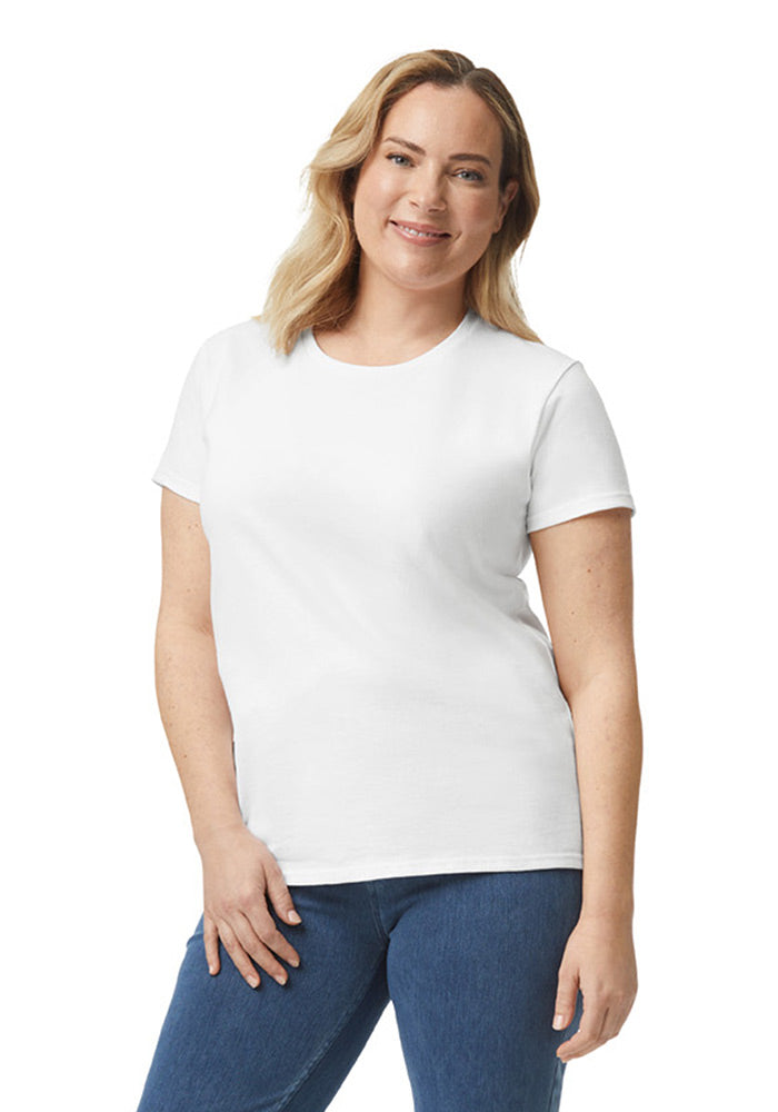 Woman wearing a Gildan 5.3 oz. heavy cotton, modern-fitted, plain white short-sleeved t-shirt and blue jeans on a white background
