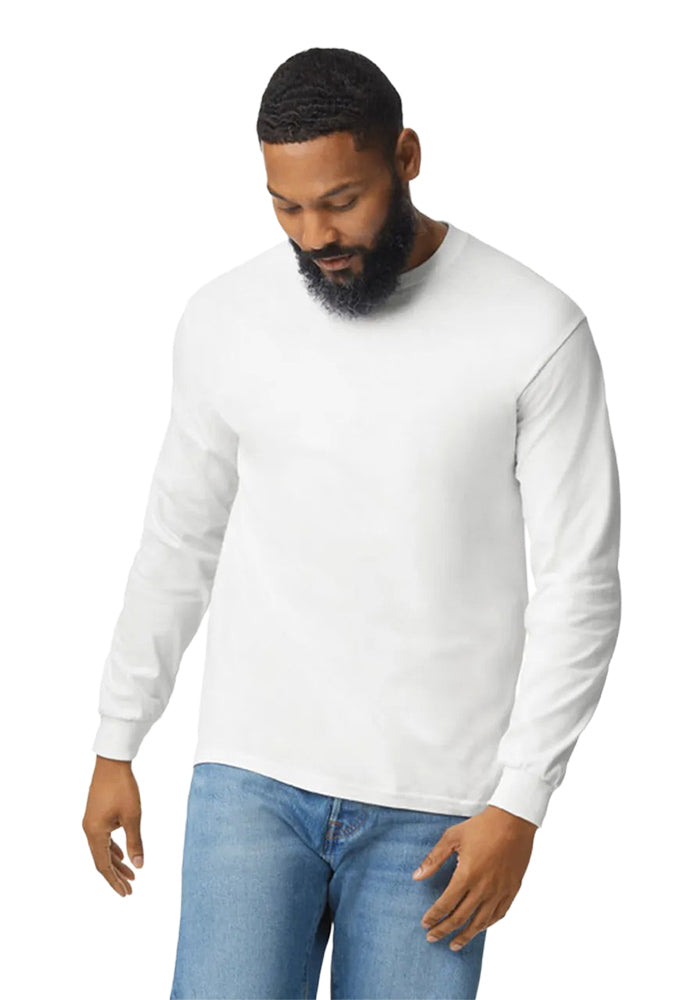 Man wearing a Gildan 5.3oz. Cotton Long Sleeve T-shirt and blue jeans on a white background.