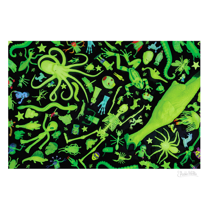 Discover the Glow Chamber Puzzle, a collection of toys and objects in ghostly green set against a black background, featuring animals, skeletons, and stars.