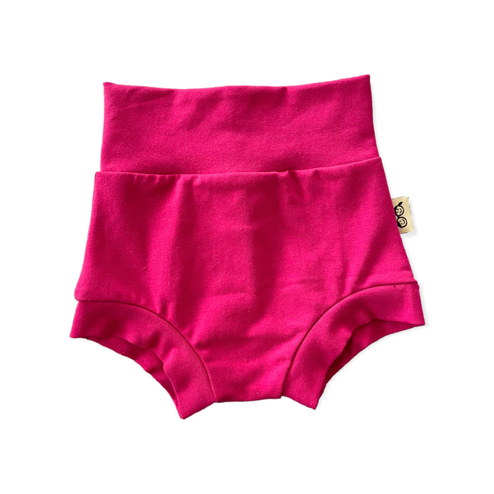 Handmade hot pink baby bummies with a fold-over waistband, displayed flat on a white background. Soft, stretchy, and comfortable for newborns, infants, and toddlers. Perfect for warm weather, layering over diapers, or pairing with bodysuits and tops. Available in sizes preemie to 4T.