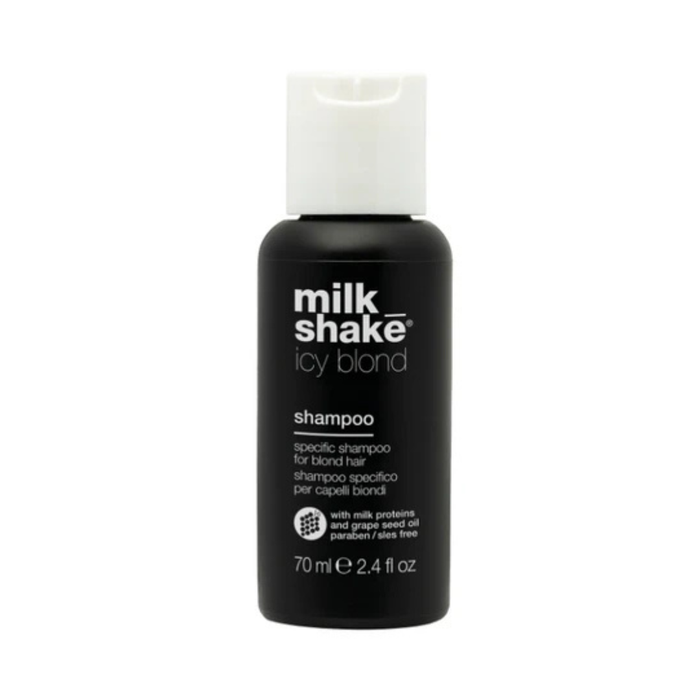 Black shampoo bottle with white cap labeled 'milk shake icy blond' on a white background
