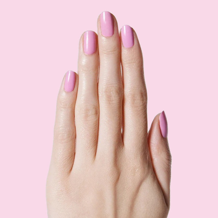 Hand with nails painted in JM pinky lavender gel polish for a fresh and feminine manicure by Olive and June