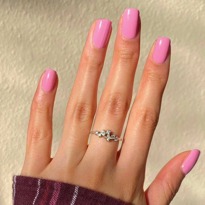 Hand showing nails polished in JM gel polish, a pinky lavender shade, for a neat and fresh manicure by Olive and June