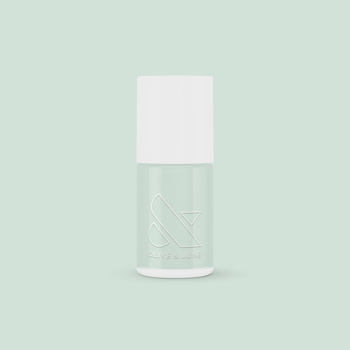 KMC sage green gel polish bottle from Olive and June for long-lasting, quick-dry at-home manicure looks