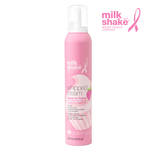 Pink bottle of milk_shake whipped cream leave-in foam on a white background