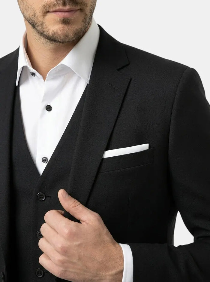 Max men's suit with breathable fabric and tailored fit, suitable for weddings and formal events, shown in a stylish formal setting.