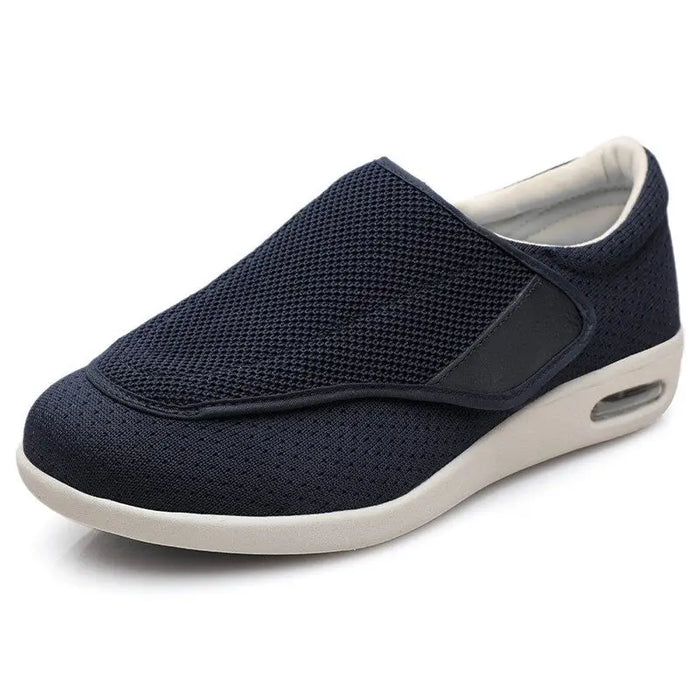 Men's breathable mesh trainers with extra-wide fit and adjustable comfort straps, designed for all-day support and airflow.
