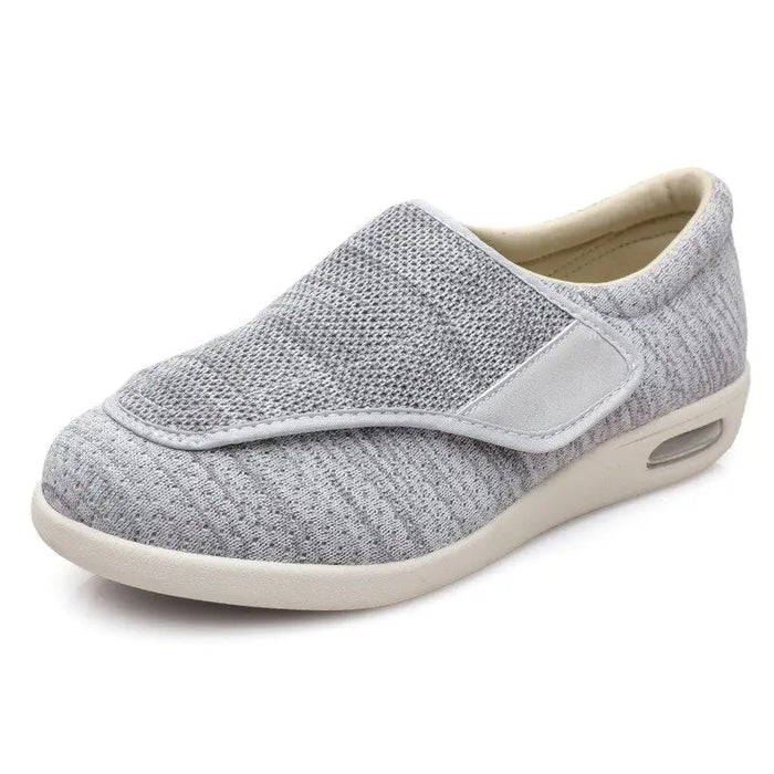 Men's breathable mesh trainers with extra-wide fit and adjustable comfort straps, designed for casual wear.