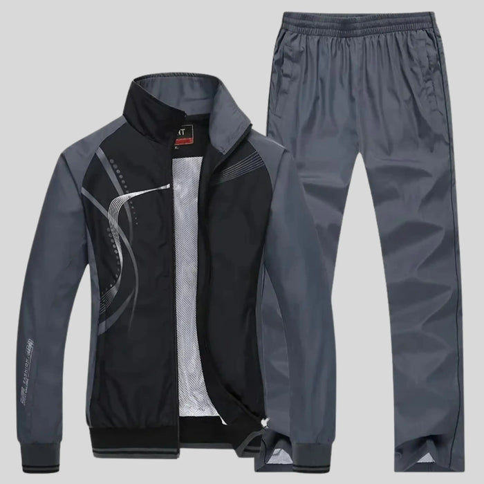 Men's polyester training set with stylish zip-up jacket and trousers from LondonLaneStore, designed for comfort and active wear.