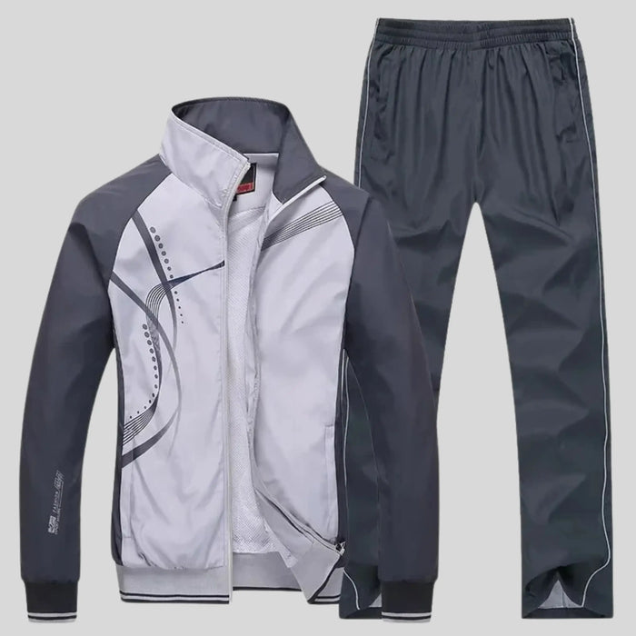 Men's polyester training set featuring a stylish zip-up jacket and matching trousers for comfortable active wear.
