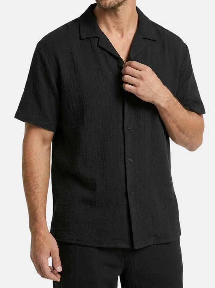 Men's crinkle fabric two-piece set with relaxed camp collar shirt and elasticated waist shorts, casual summer style.