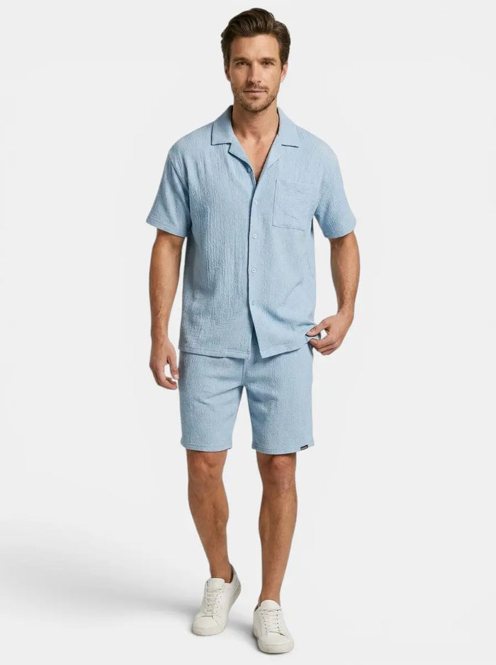 Men's crinkle fabric two-piece set with relaxed camp collar shirt and elasticated waist shorts, stylish men's summer leisure wear.