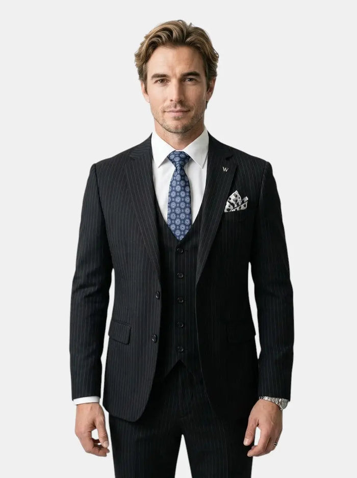 Men's slim fit suit made from high-quality fabric, elegant wedding attire, tailored fit, in classic dark color with lapel details.