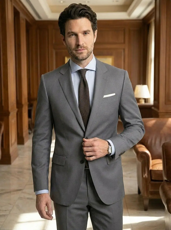 Men's lightweight fabric suit featuring a classic single-breasted jacket and slim fit trousers, styled for a sharp, modern look.