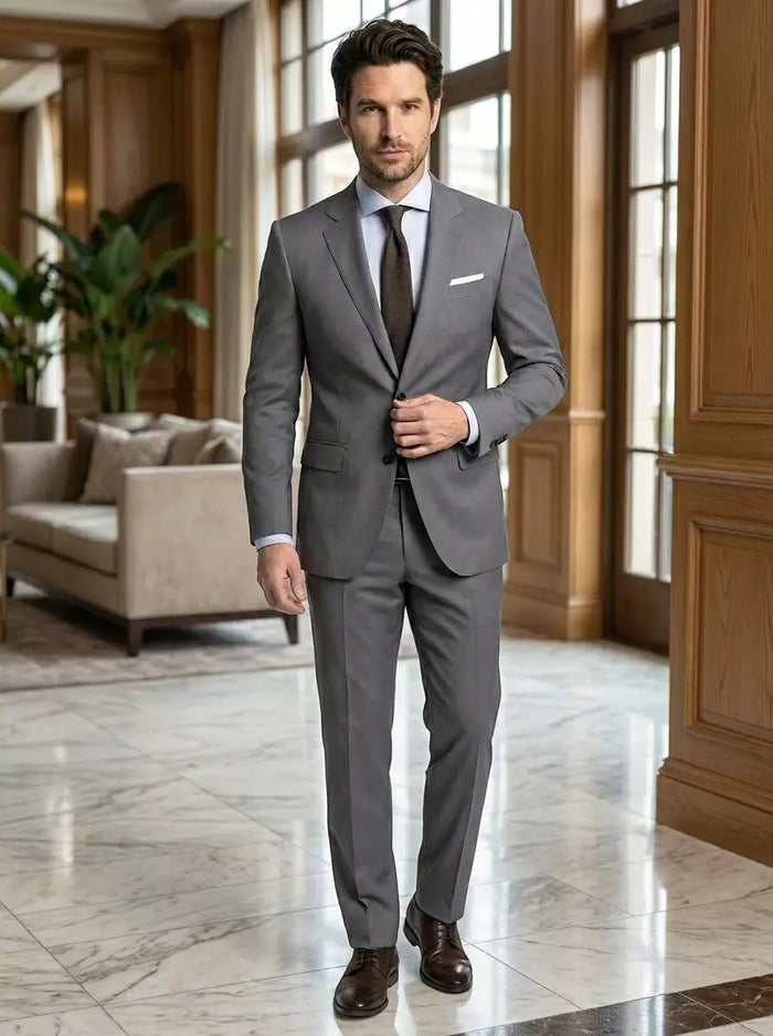 Men's lightweight fabric suit featuring a classic single-breasted jacket and slim-fit trousers, ideal for formal occasions.