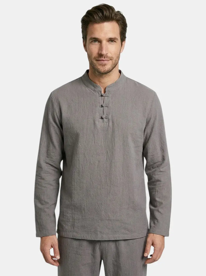 Men's linen blend two-piece set with a relaxed fit, featuring a long sleeve top and drawstring trousers, styled for casual wear.