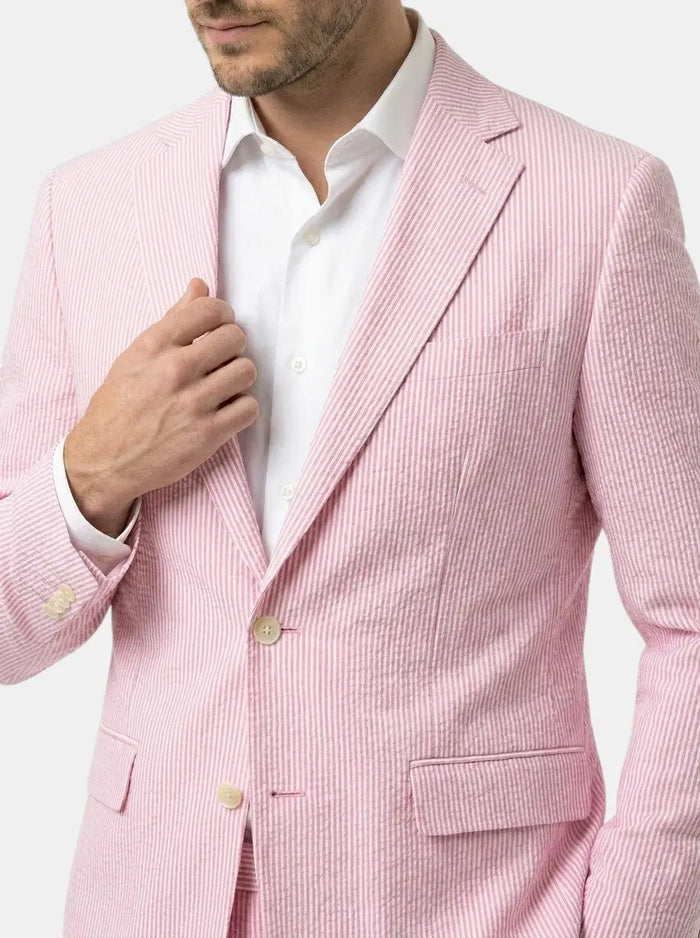 Lightweight Milo men's pinstripe slim fit suit for weddings, shown on a hanger with a crisp white shirt and matching tie.
