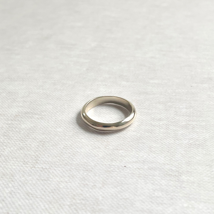 Species by the Thousands curved minimal  band in brass.