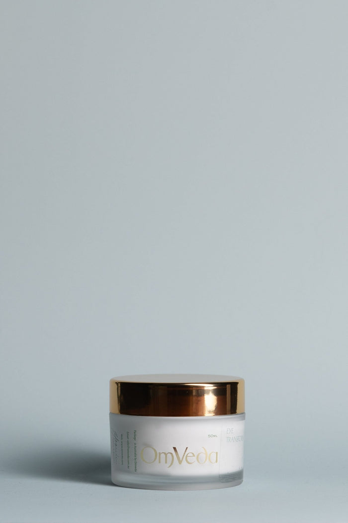 OmVeda Eye Transform cream jar with gold lid, white jar