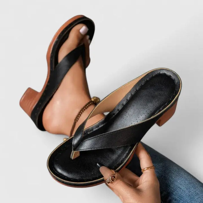 Elegant black orthopedic women's closed-toe heels with a block heel and classic pump design for comfortable support.