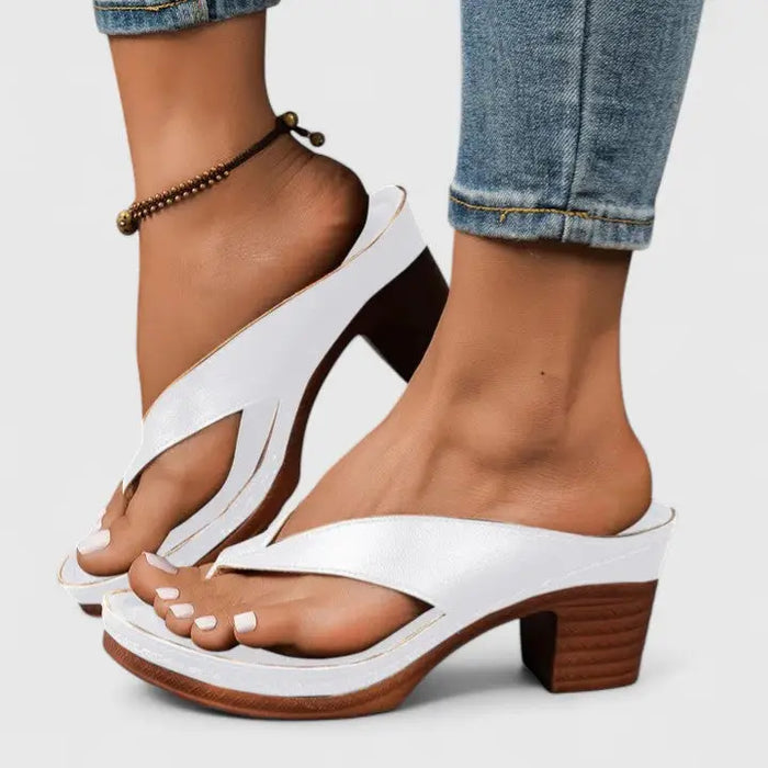 Elegant beige orthopedic women's closed-toe heels with block heel and classic pump design, offering comfort and support.