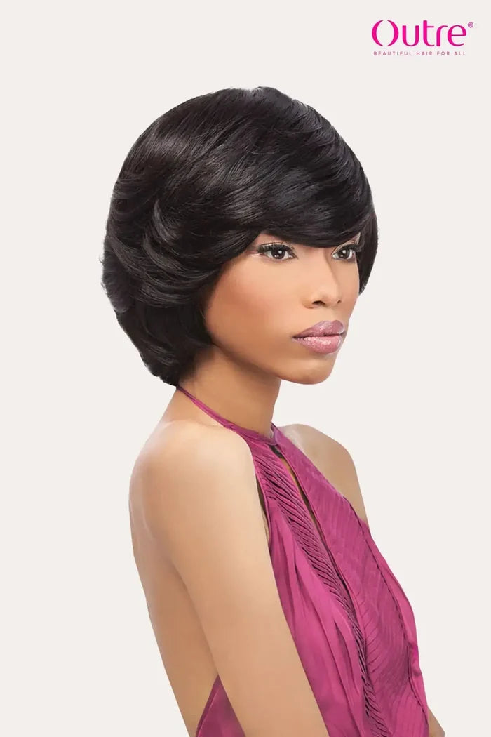 Model wearing Outre Velvet Remi Tara 4-6-8 human hair weave styled in a voluminous mushroom cut and sleek short bob
