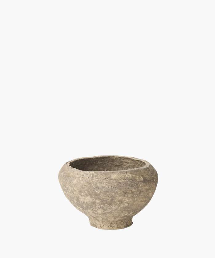 A rustic, paper mache bowl with a textured surface, showcasing shades of gray and subtle patches of darker tones. The bowl exudes an ancient, historical feel. | Wildwood Home Co.
